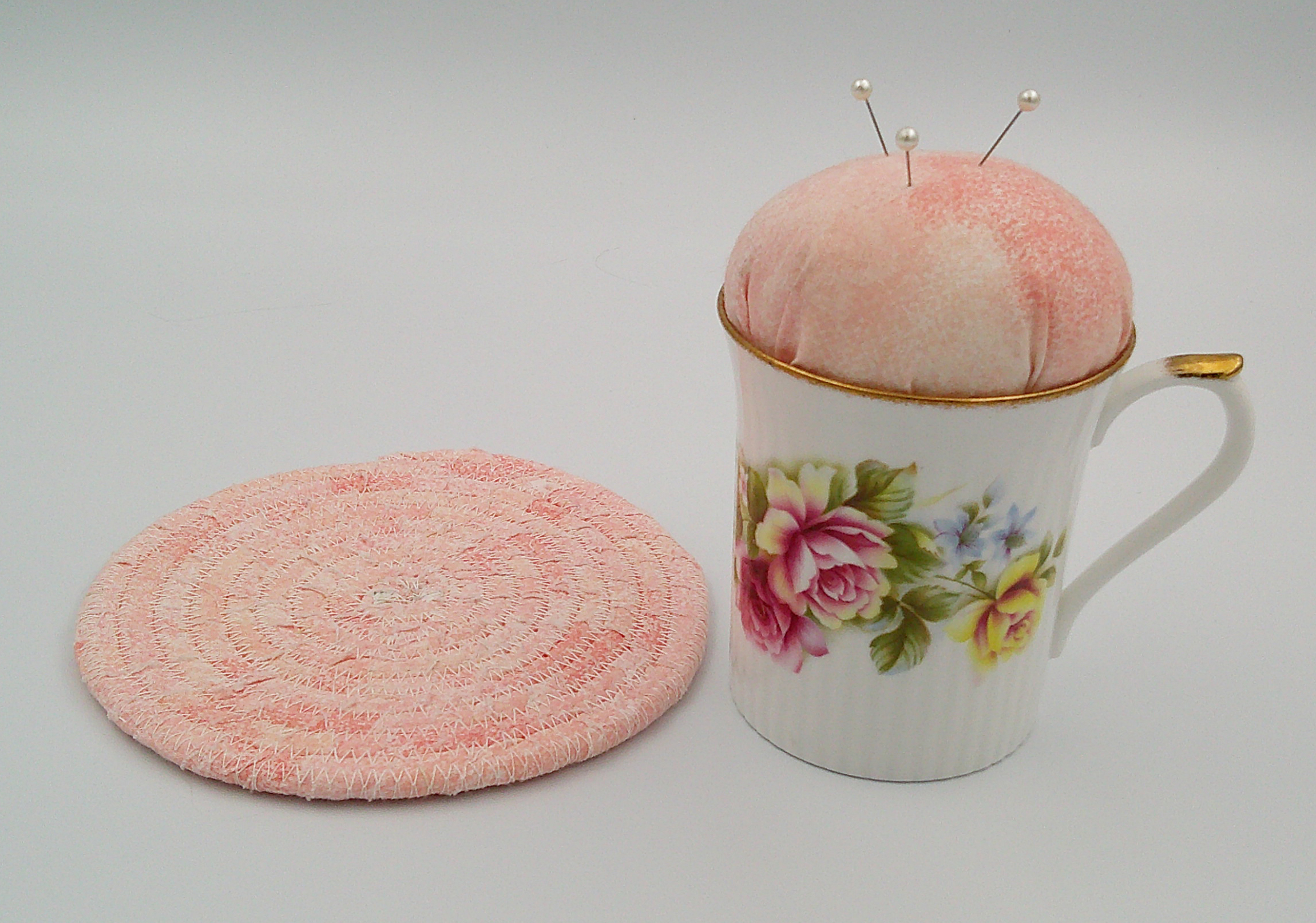 This is a view of the trivet beside the teacup pincushion. This is a view of the trivet beside the teacup pincushion.
